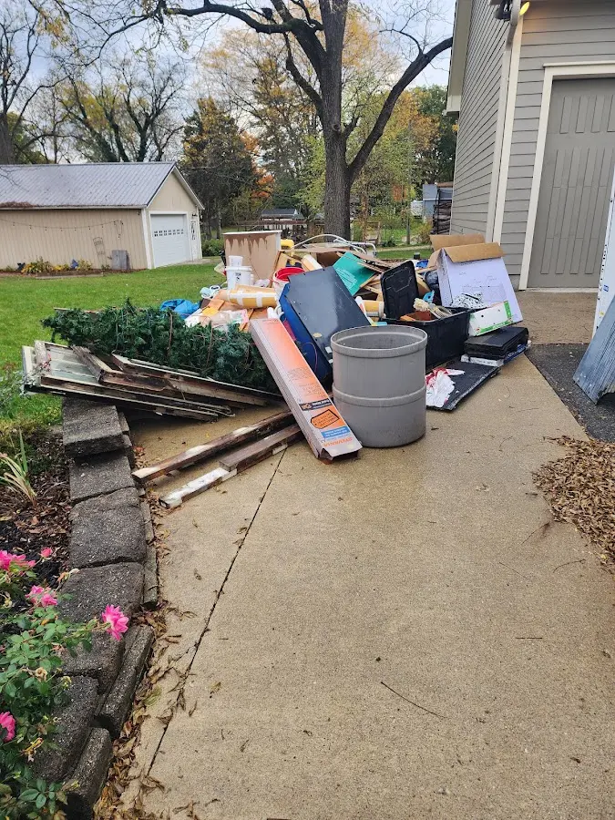 Dumpster being loaded with debris for Commercial Dumpster Rental in Odessa